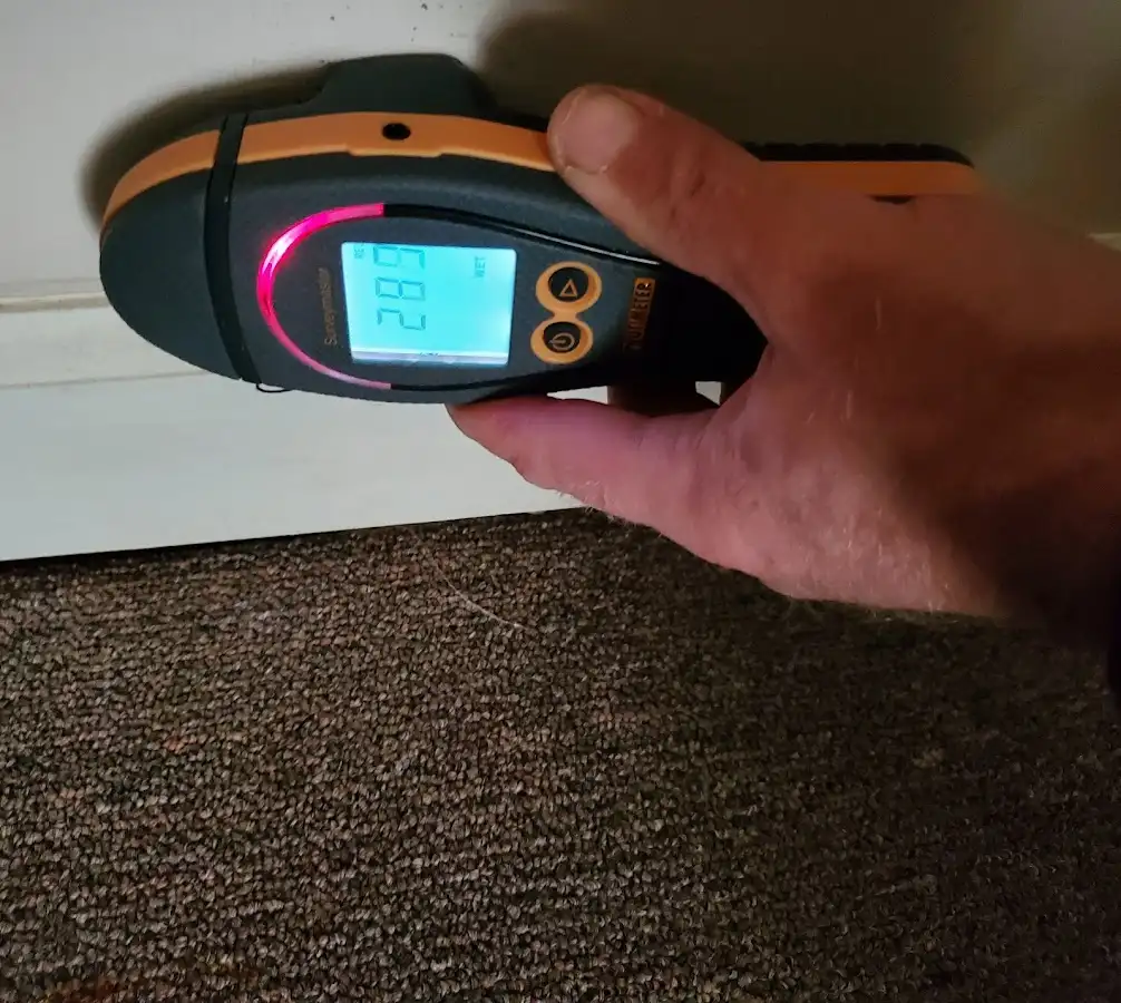 Moisture detection at baseboard during Storm Damage Restoration in Solvang